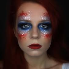 red hair and blue eyes paint on her face