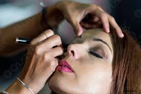 professional makeup artist working with