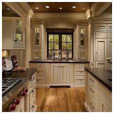 Cream and antique white kitchens are essentially timeless. Rustic Cream Cabinets Google Search Antique White Kitchen Cabinets New Kitchen Cabinets Rustic Kitchen