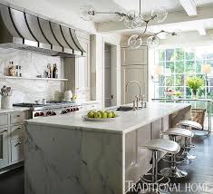 The waterfall countertop trend is really strong right now so it's about time we talked about it in more a waterfall countertop is easily recognizable by the fact that it drops vertically down the sides instead. Island With Calcutta Gold Marble Waterfall Countertop Transitional Kitchen