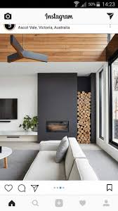 modern black fireplace with log storage