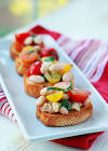 bruschetta with white beans  tomatoes and olives