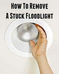 remove a stuck outdoor flood light