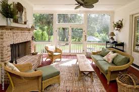 Screen Porch With Fireplace And Wicker