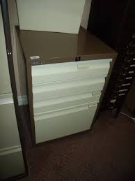 bisley four drawer metal filing cabinet