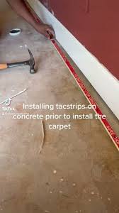 installing carpet strips on concrete