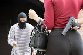 Male robber standing and looking at young woman and young woman hide gun in  his back/self-defense of woman,criminal concept Stock Photo | Adobe Stock