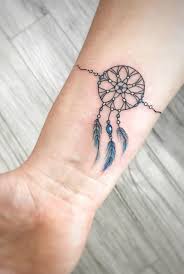 Here you can see someone has got creative with the style of webbing in the dreamcatcher design having a mixture of star style. Dream Catcher Tattoo Ideas Dream Catcher Tattoo Feather Tattoos Dream Catcher Tattoo Small