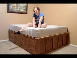 A Queen Size Bed With Drawer Storage