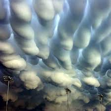 A wall cloud is a cloud that is lowered from a thunderstorm, forming when rapidly rising. Mammatus Clouds Over Nebraska After A Tornado Weather