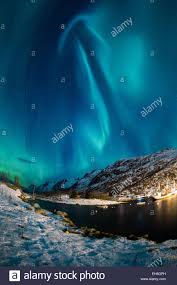 Northern Lights Aurora Borealis Above A Winter Scene Stock