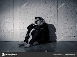 portrait sad depressed young man crying