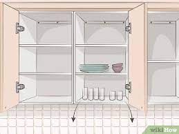 Sanding is often one of the first steps in renovating kitchen cabinets, whether you plan to paint or stain the wood to brighten and restore it. 3 Ways To Remove Kitchen Cabinets Wikihow