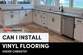can i install vinyl floors under cabinets