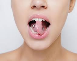 piercings or tongue piercing