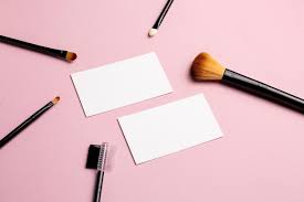 makeup brush and white business card