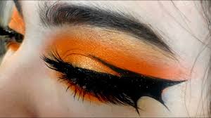 orange makeup bat wing eyeliner