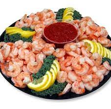 For this shrimp cocktail recipe, use large shrimp with the shell on or tail on for the most stunning presentation. Cocktail Shrimp Platter Kirk Market Funeral Food Party Food Menu Easy Dinner Party Recipes