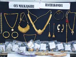 young woman steals jewellery from in