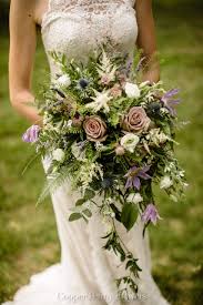 A small, beautiful bouquet of pink roses is decorated with greenery. Types Of Bridal Bouquets What To Consider Local Concord Florist Copper Penny Flowers