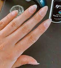 Place the nail with the polygel onto your nail, ensuring it covers the whole nail and then gently hold it in place whilst your look at the underneath and spread any excess gel out towards the tip. Doing Your Own Polygel Nails At Home Through New Eyes