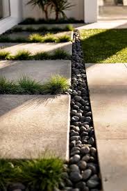 With both traditional and modern designs to choose from in a range of colours and styles. Concrete Pavers Black Pebbles Google Search Backyard Landscaping Designs Garden Pavers Landscape Design
