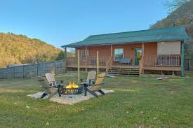Cabins with an outdoor firepit. Lonestar 1 Level Cabin With Private Fenced In Yard
