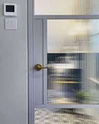 Steel Door And Fluted Glass Exterior