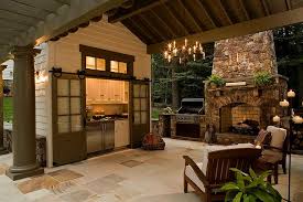Outdoor Kitchen With Gray Barn Doors On