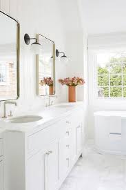 In this bathroom, white coats every surface, except the wood vanity, to maximize the bright, expansive effect. 60 White Bathroom Timeless Look Clean And Fresh Bathrooms