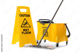 sign with phrase caution wet floor mop