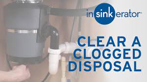 clear a clogged garbage disposal