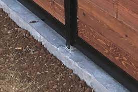 install a fence mounted to concrete