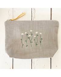 embroidered makeup bag daisies on grey