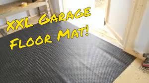 a huge garage floor mat to protect the