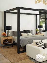 This bed brings a sleek contemporary design to the classic canopy bed silhouette. A Black Canopy Bed Featured In Hgtv Magazine Canopy Bedroom Sets Canopy Bedroom Canopy Bed Frame
