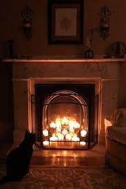 A Fireplace Mantle With Flameless Candles
