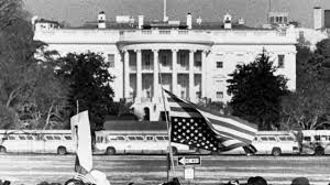 nonvoters have valid criticisms of the united states government archival image of protestors holding an upside down flag in front of the white house