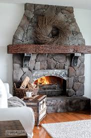 Rock Floor To Ceiling Fireplace With