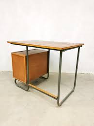 This new version uses electric actuators to raise and lower the top instead of the manual hand crank, making it more. Vintage Industrial Writing Desk For Sale At Pamono