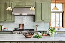 green cabinets with blue gl subway