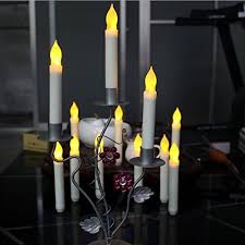 Amazon Com Box Of 12 Battery Operated Led Tapered Candles W Flickering Light Bulbs Home Kitchen