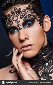 young man wiht dark makeup stock photo