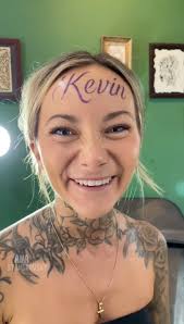 woman claims forehead tattoo of