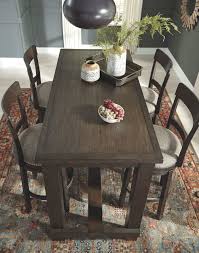 Add a traditional bar & pub table set to your home to add flexibility to your dining options. The Drewing Brown 5 Pc Rectangular Bar Table 4 Upholstered Swivel Barstools Available At Royal Star Furniture Serving St Paul Mn