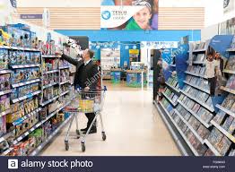 A Man Shopping In A Tesco Supermarket Entertainment Aisle