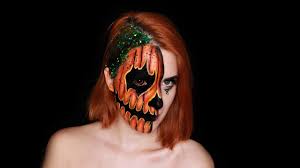 half face pumpkin face paint design