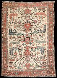 antique heriz rug in a ivory field with
