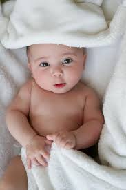 photo of baby boy looking at camera