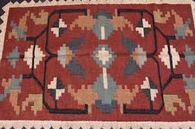 red wool jute rug handmade motifs
